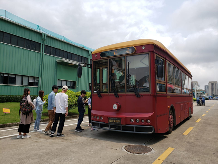 Delegates take a tour around the Yinlong manufacturing plant on one of its EV Buses 